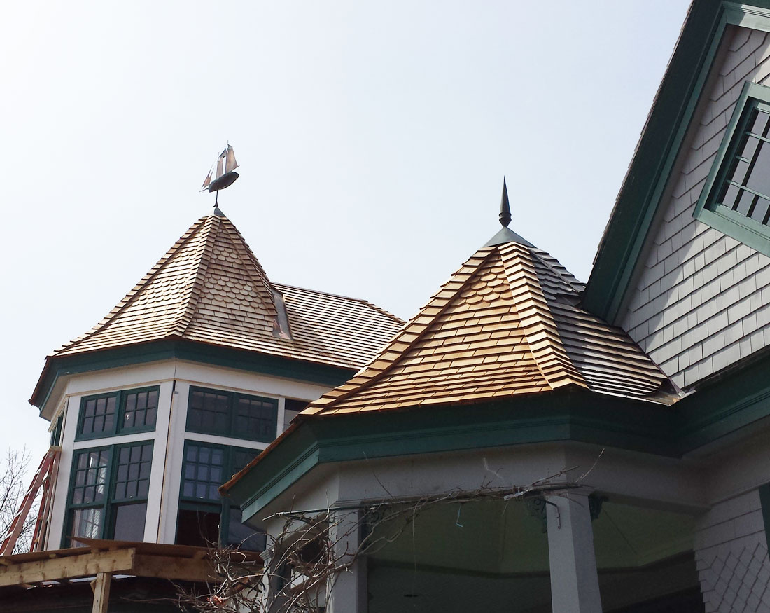 Intricate roof designs with weathervane